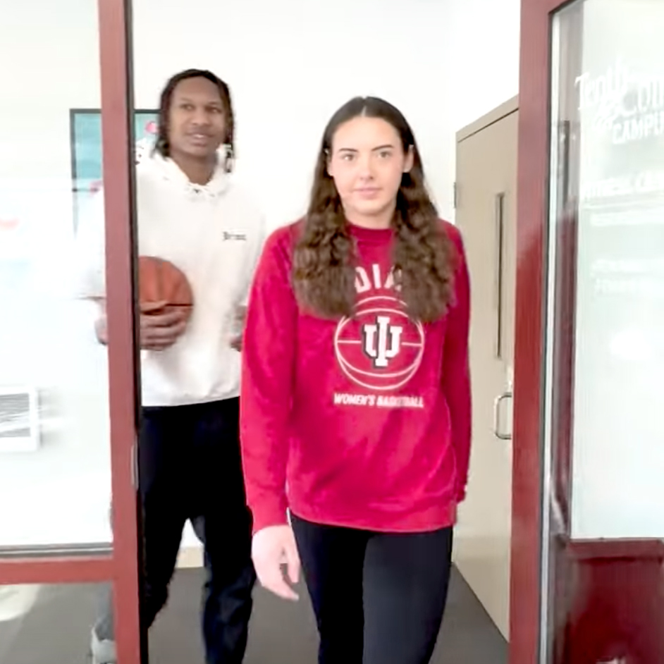 Mackenzie Holmes and Malik Reneau check out Tenth & College Apartments by Cedarview Management in Bloomington, Indiana